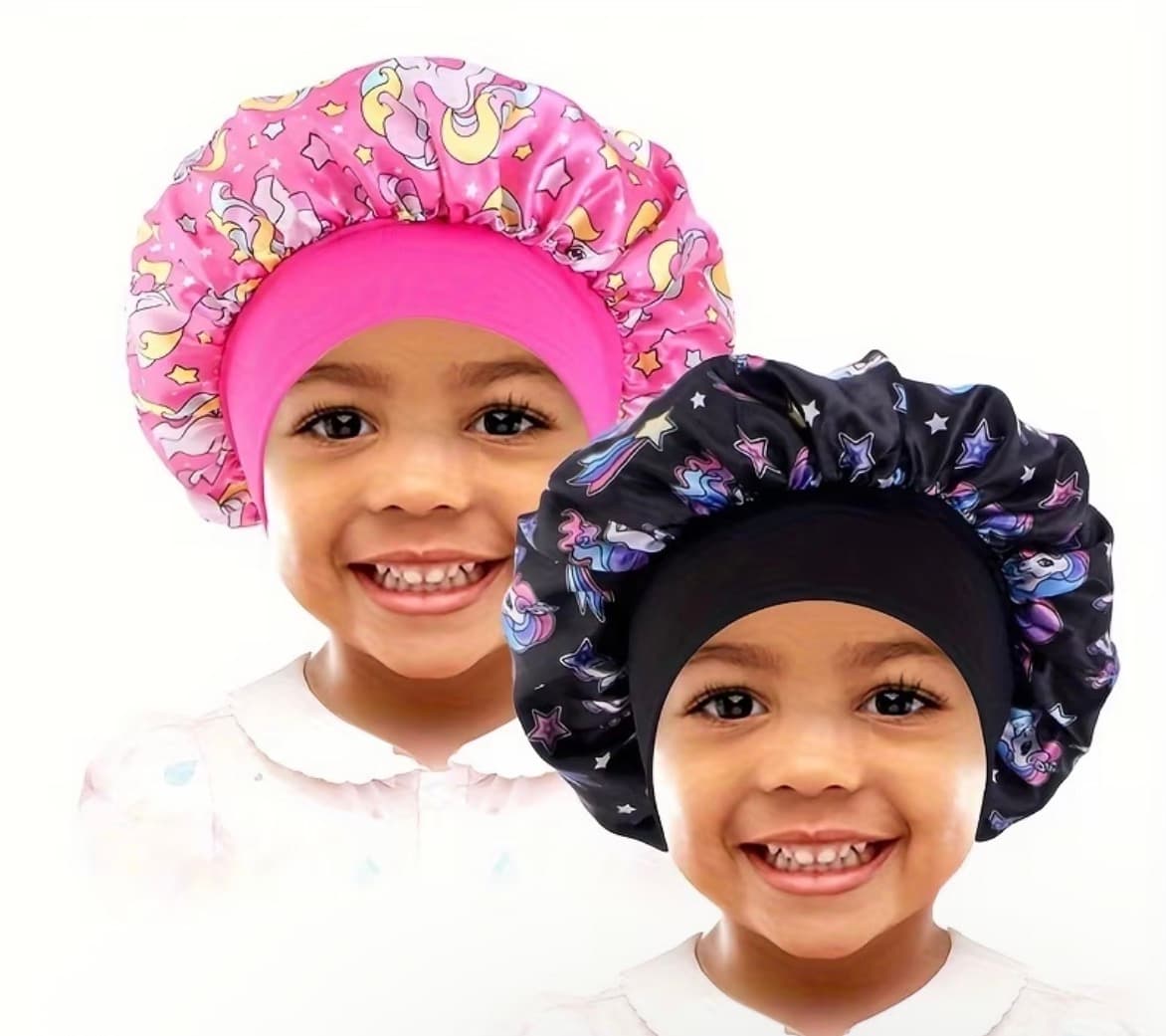 Little girl wearing celestial unicorn satin bonnet